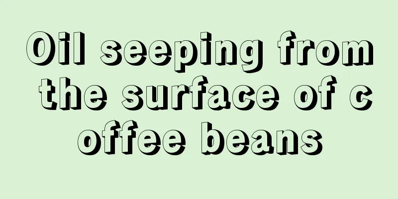 Oil seeping from the surface of coffee beans